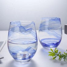 Glass cup with blue print on