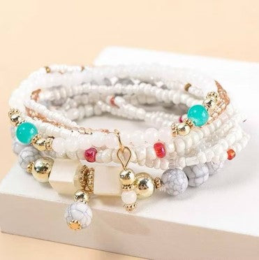 White bracelet with different colored ornaments